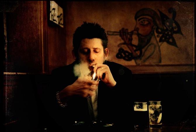 Shane MacGowan enjoys a pint.