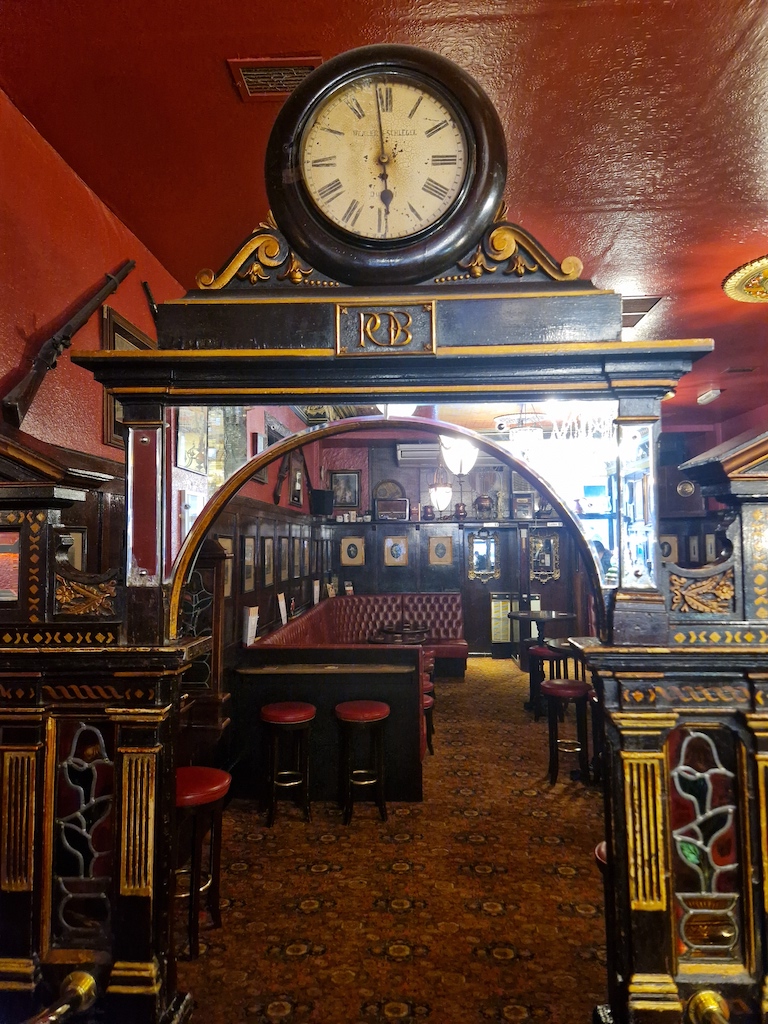 Antique clock in The Long Hall, Dublin