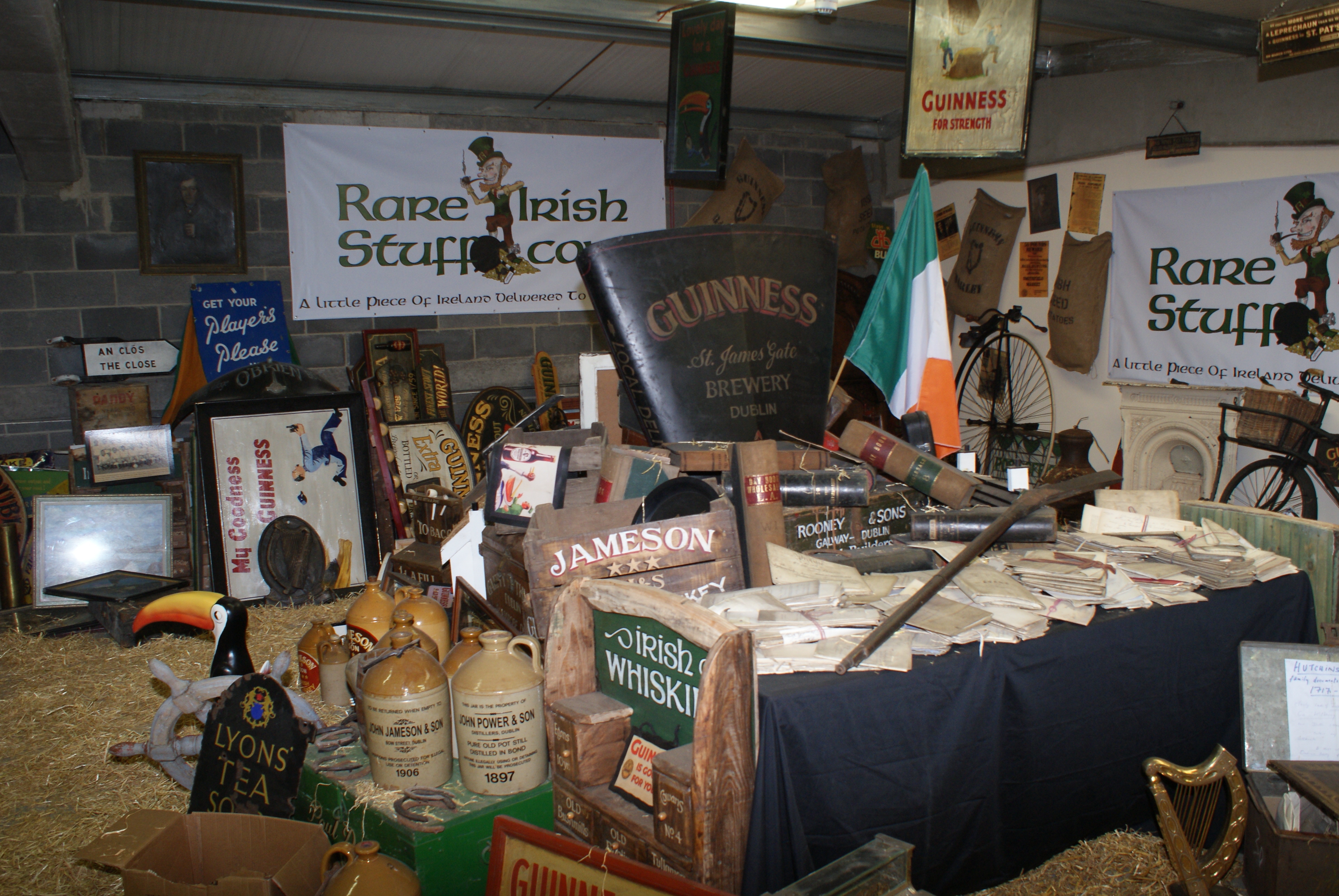 Rescued contents of traditional Irish pubs stored at Rare Irish Stuff, including vintage brewery signs, pub mirrors, vintage posters and prints, whiskey crates and historic pub memorabilia preserved from pubs across Ireland.